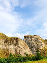 Rock formations on landscape against sky