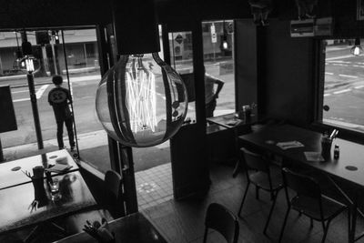 Empty chairs and tables in restaurant