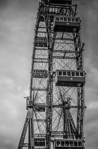 Low angle view of electricity pylon against sky