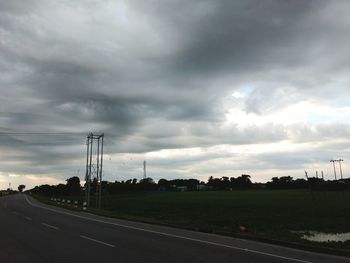 Road by highway against sky