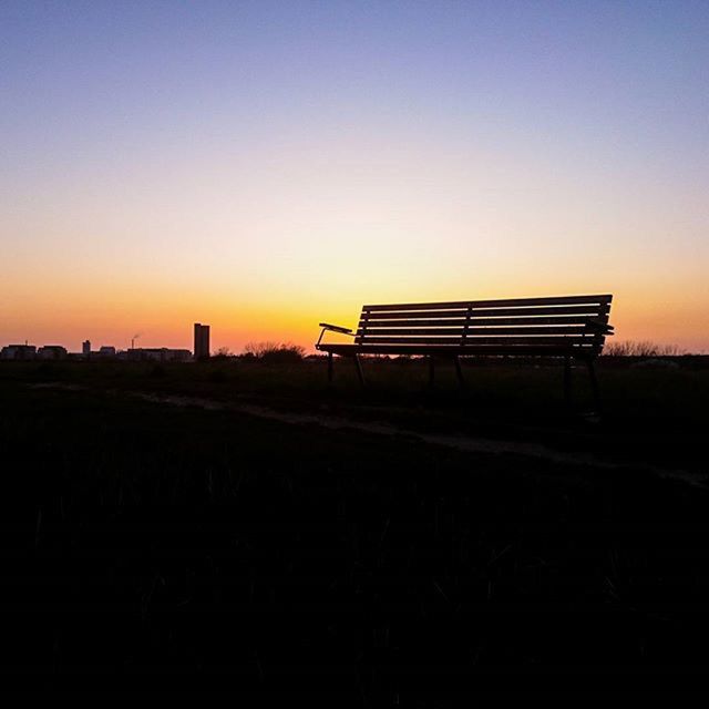 sunset, copy space, clear sky, silhouette, tranquility, tranquil scene, orange color, landscape, scenics, built structure, beauty in nature, nature, field, sky, architecture, empty, building exterior, outdoors, no people, bench