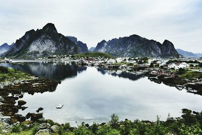 Scenic view of lake and mountains against sky