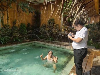 People on swimming pool in lake