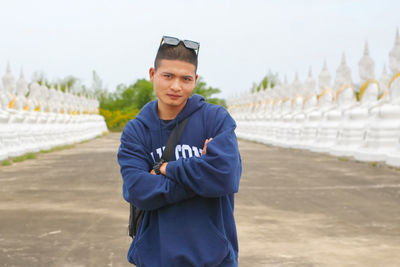 Portrait of a handsome young man standing outdoors