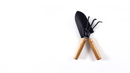 High angle view of pencil on wood against white background