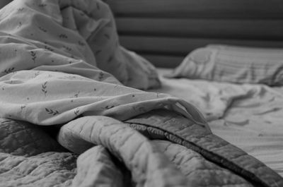 Close-up of blanket on bed at home