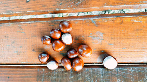 Directly above shot of chestnuts on wooden table