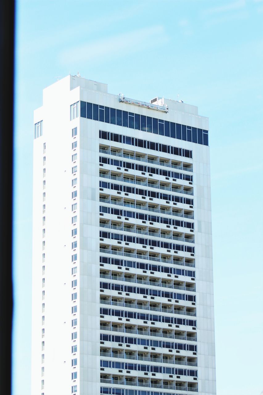 VIEW OF OFFICE BUILDING AGAINST SKY