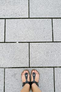 Low section of woman standing on floor