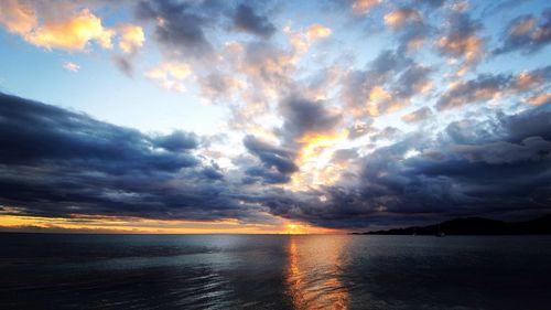 Scenic view of sea against dramatic sky