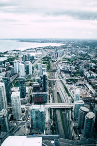 High angle view of modern buildings in city against sky