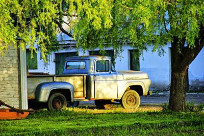 Abandoned car parked on field