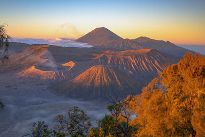 Scenic view of mountains against sky during sunset