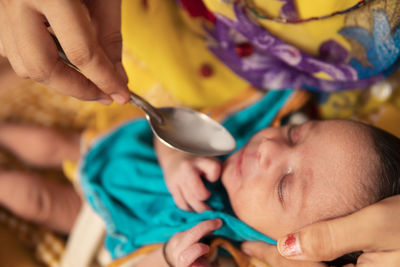 Cropped image of man holding thermometer