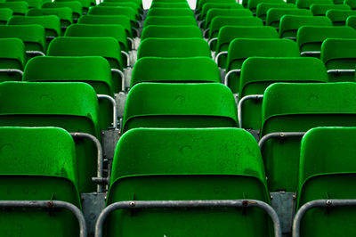 Full frame shot of green empty chairs