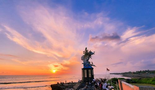 Beautiful view of the sunset and the iconic statue of the gajah mina