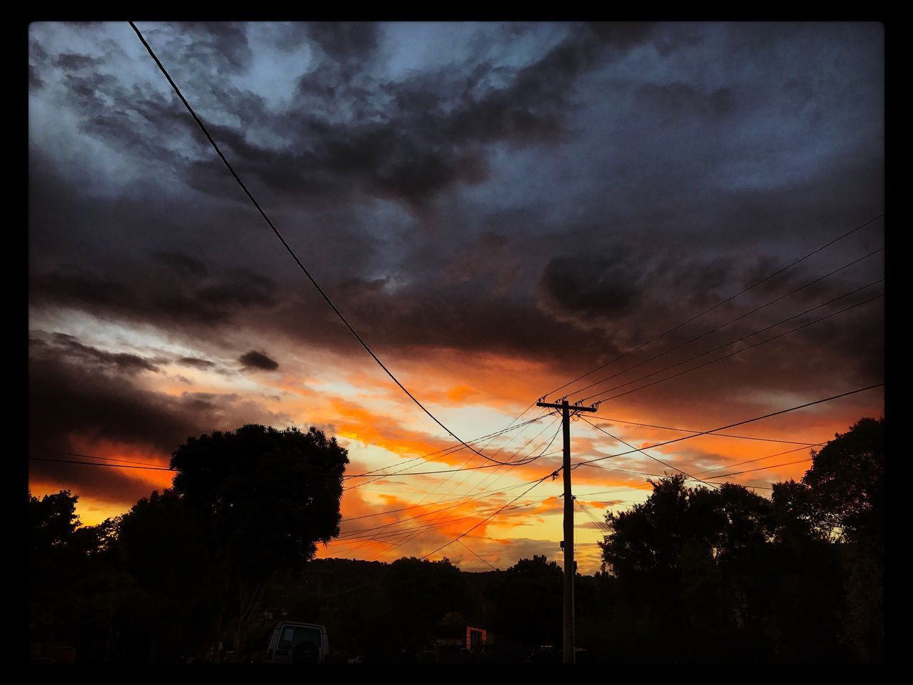 sunset, sky, electricity, cloud - sky, power supply, power line, silhouette, nature, beauty in nature, no people, outdoors, scenics, tree, connection, cable, dramatic sky, low angle view, electricity pylon, technology, day