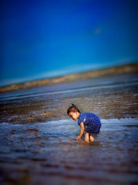 Full length of boy on beach