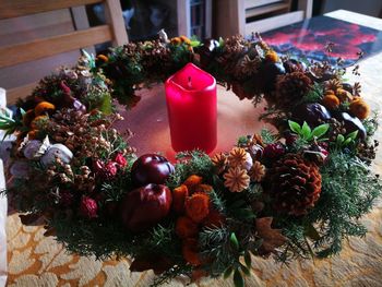 Close-up of christmas flowers on table