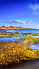 View of lake against cloudy sky