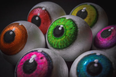 Close-up of multi colored balls on table