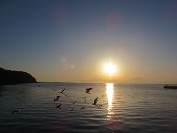 Scenic view of sunset over calm sea