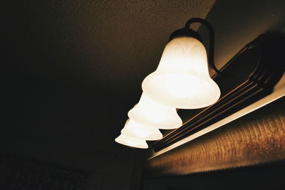 Low angle view of illuminated lamp