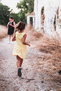 Rear view of women running