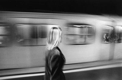 Blurred motion of person walking on road