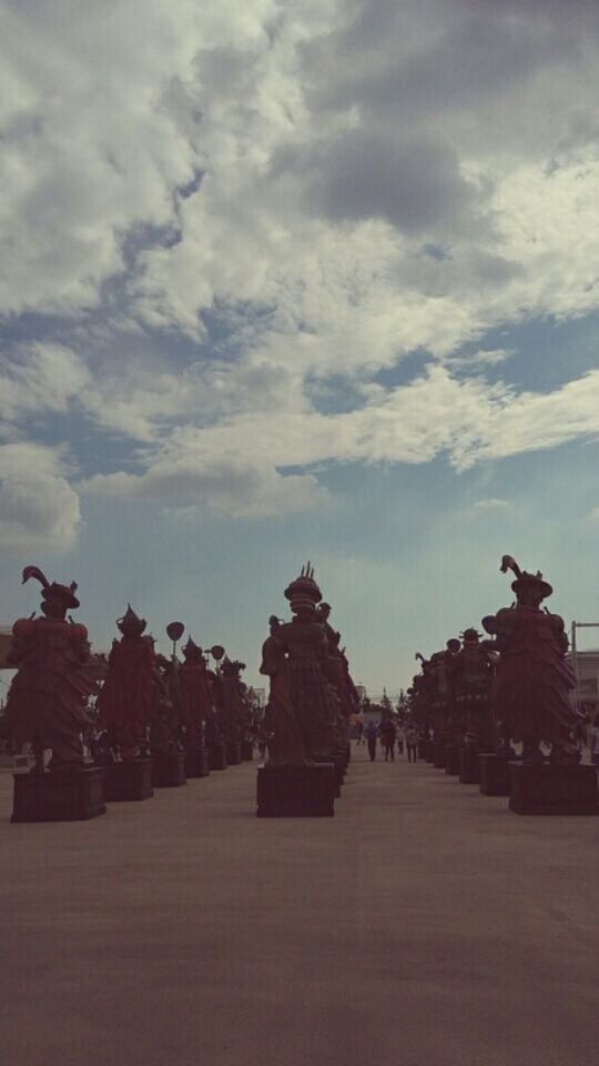 sky, cloud - sky, architecture, religion, built structure, place of worship, building exterior, spirituality, temple - building, cloudy, famous place, cloud, travel destinations, history, tourism, art and craft, travel, statue, outdoors