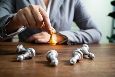 Midsection of man playing chess