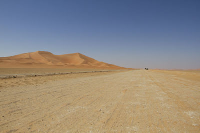 Scenic view of desert against clear sky