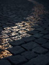 High angle view of cobblestone street in city