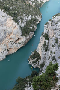 High angle view of rock formations by sea