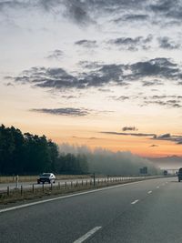 Scenic view of road against sky during sunset