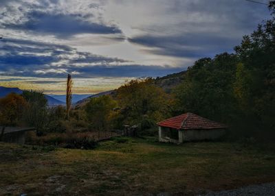 Gazebo on landscape against sky