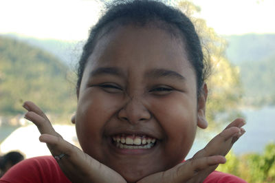 Close-up portrait of smiling girl