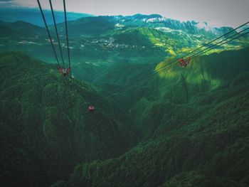 High angle view of overhead cable car against mountains