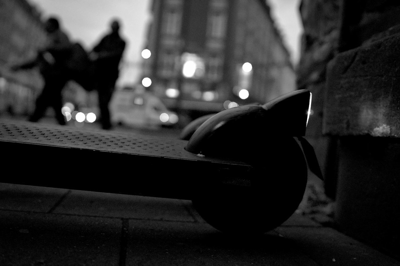black, darkness, white, light, black and white, monochrome, monochrome photography, focus on foreground, city, camera, architecture, night, street, shadow, one person, adult, lifestyles