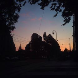 Cars on road at sunset