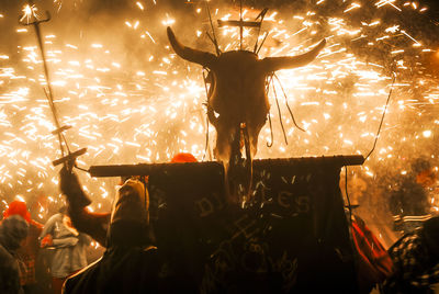 Silhouette of people at night