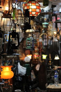 Illuminated lanterns hanging in market