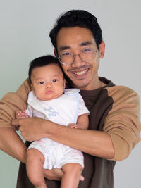 Man and baby asian and nationality thai is happy feel