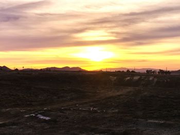 Scenic view of landscape at sunset