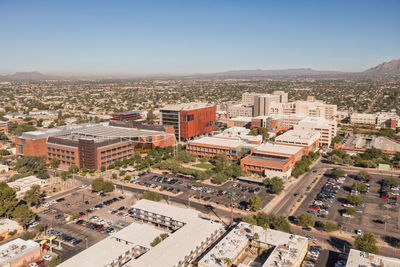 High angle view of buildings in city against clear sky