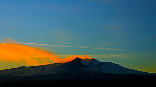 Scenic view of volcanic mountain against sky