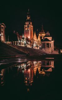 Illuminated buildings in city at night