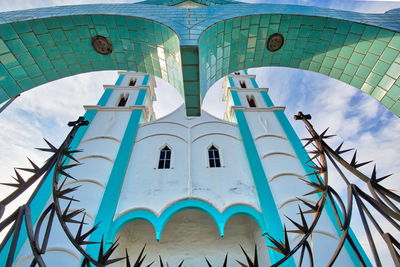 Low angle view of building against blue sky