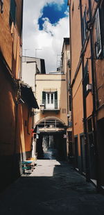 Alley amidst buildings in city