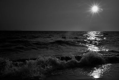 Scenic view of sea against clear sky during sunset